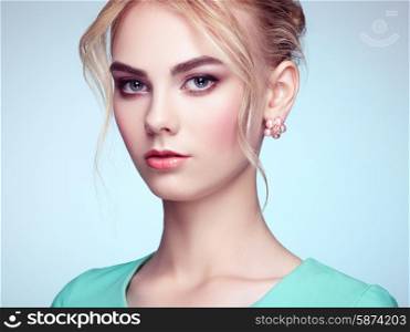 Portrait of beautiful sensual woman with elegant hairstyle. Perfect makeup. Blonde girl. Fashion photo