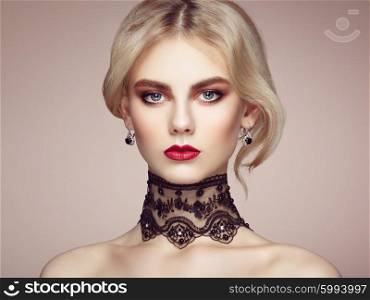 Portrait of beautiful sensual woman with elegant hairstyle. Perfect makeup. Blonde girl. Fashion photo. Jewelry and lace