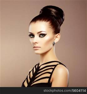 Portrait of beautiful sensual woman with elegant hairstyle. Perfect makeup. Fashion photo