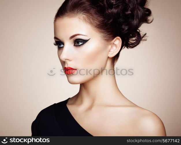 Portrait of beautiful sensual woman with elegant hairstyle. Perfect makeup. Fashion photo