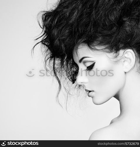 Portrait of beautiful sensual woman with elegant hairstyle. Perfect makeup. Fashion photo