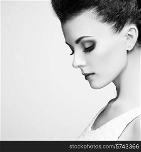Portrait of beautiful sensual woman with elegant hairstyle. Perfect makeup. Fashion photo. Black and White