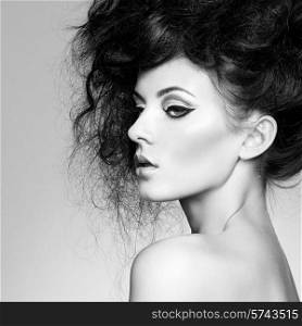 Portrait of beautiful sensual woman with elegant hairstyle. Perfect makeup. Fashion photo. Black and White