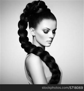 Portrait of beautiful sensual woman with elegant hairstyle. Perfect makeup. Girl pigtailed. Fashion photo. Black and white photo