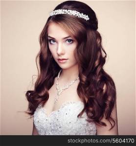 Portrait of beautiful sensual woman with elegant hairstyle. Wedding dress. Fashion photo