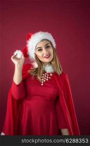 Portrait of beautiful sexy girl wearing Santa Claus clothes on red background