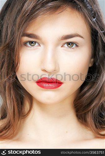 Portrait of beautiful sexy woman with sensual red lips closeup. Studio shot