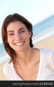 Portrait of beautiful smiling woman at the beach