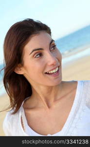 Portrait of beautiful smiling woman at the beach