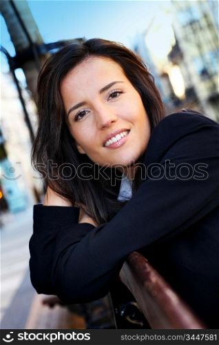 Portrait of beautiful smiling woman in town