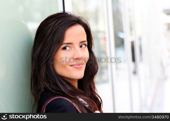 Portrait of beautiful smiling woman in town