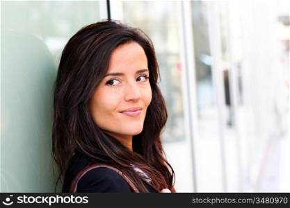 Portrait of beautiful smiling woman in town