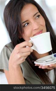 Portrait of beautiful woman drinking tea
