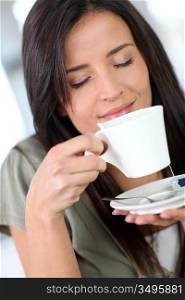 Portrait of beautiful woman drinking tea