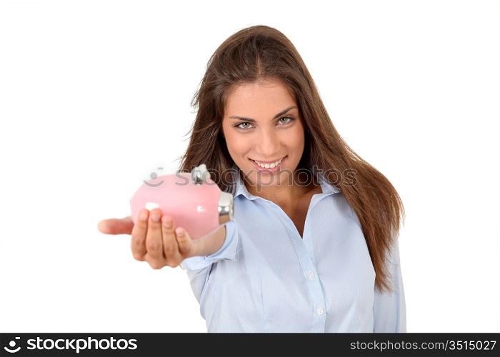 Portrait of beautiful woman holding piggybank
