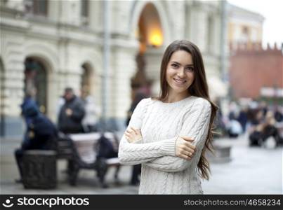 Portrait of beautiful woman in autumn street