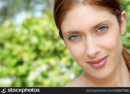 Portrait of beautiful woman in natural background