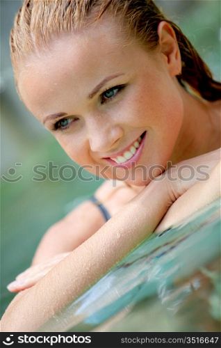 Portrait of beautiful woman in pool