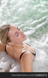 Portrait of beautiful woman in spa jacuzzi