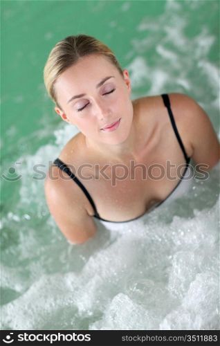 Portrait of beautiful woman in spa jacuzzi