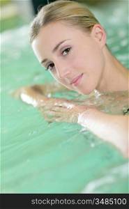 Portrait of beautiful woman in spa water