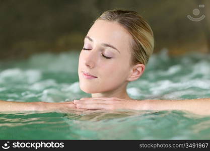 Portrait of beautiful woman in spa water