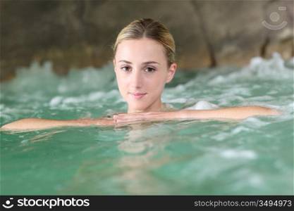Portrait of beautiful woman in spa water