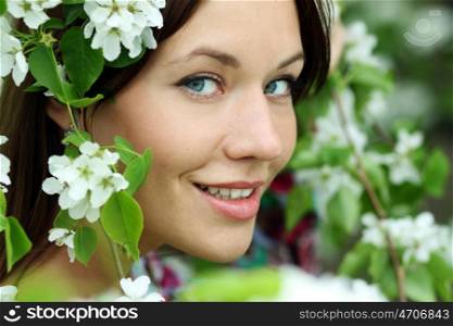 Portrait of beautiful woman in spring blossom