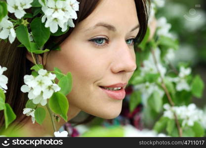 Portrait of beautiful woman in spring blossom