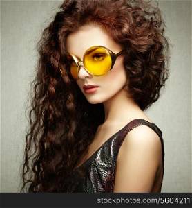 Portrait of beautiful woman in sunglasses on white background. Fashion photo