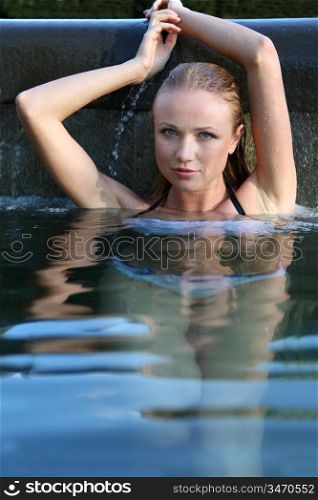 Portrait of beautiful woman in water