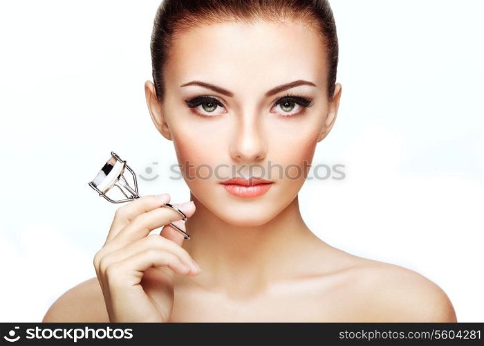 Portrait of beautiful woman making curl eyelashes. Beautiful woman face. Perfect make-up