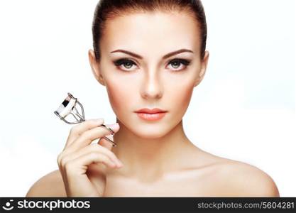 Portrait of beautiful woman making curl eyelashes. Beautiful woman face. Perfect make-up