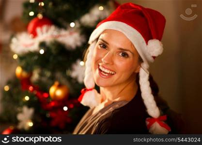 Portrait of beautiful woman near Christmas tree&#xA;