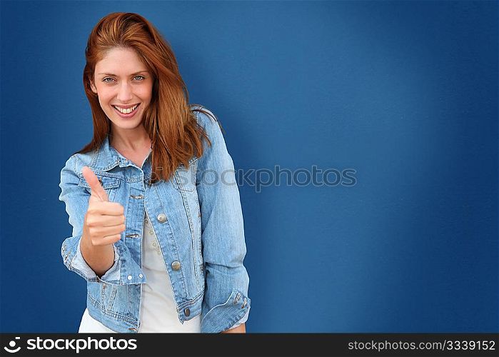Portrait of beautiful woman on blue background