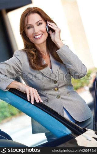 Portrait of Beautiful Woman or Businesswoman On Her Cell Phone