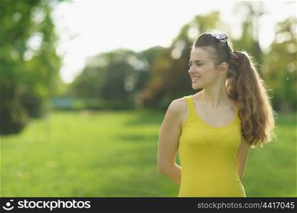 Portrait of beautiful woman outdoors looking on copy space