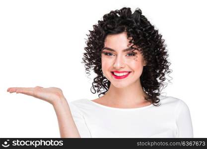 Portrait of beautiful woman. Portrait of amazing beautiful smiling woman with curly hair on white background showing copy space