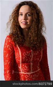portrait of beautiful woman. portrait of beautiful caucasian woman with curly hair at studio