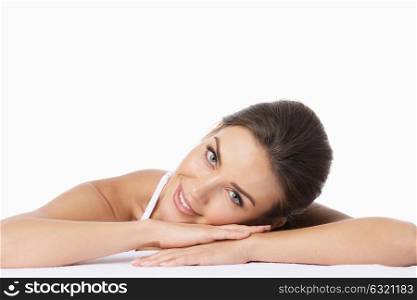 Portrait of beautiful woman. Portrait of beautiful woman laying on arms and looking at camera