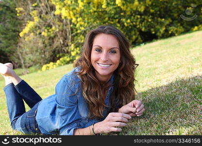 Portrait of beautiful woman relaxing in home garden