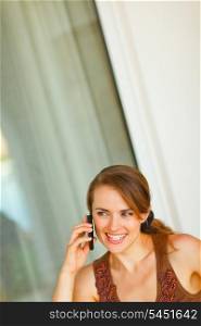 Portrait of beautiful woman speaking mobile phone&#xA;