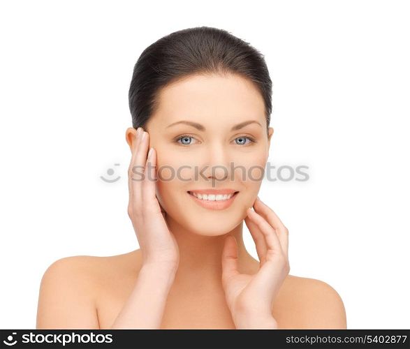 portrait of beautiful woman touching her face