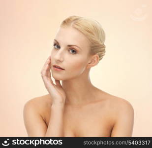 portrait of beautiful woman touching her face