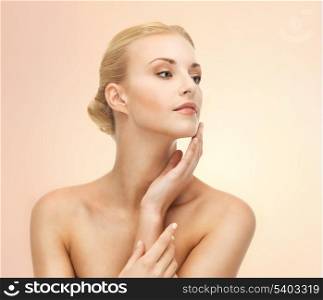 portrait of beautiful woman touching her face