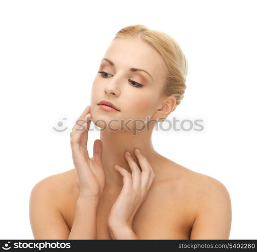 portrait of beautiful woman touching her face skin