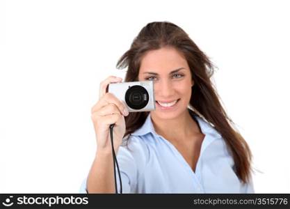 Portrait of beautiful woman using compact digital camera