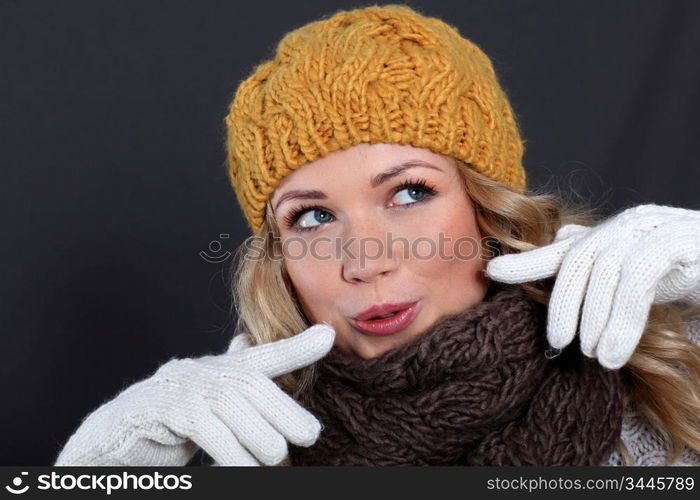 Portrait of beautiful woman wearing winter accessories