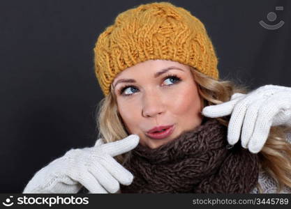 Portrait of beautiful woman wearing winter accessories