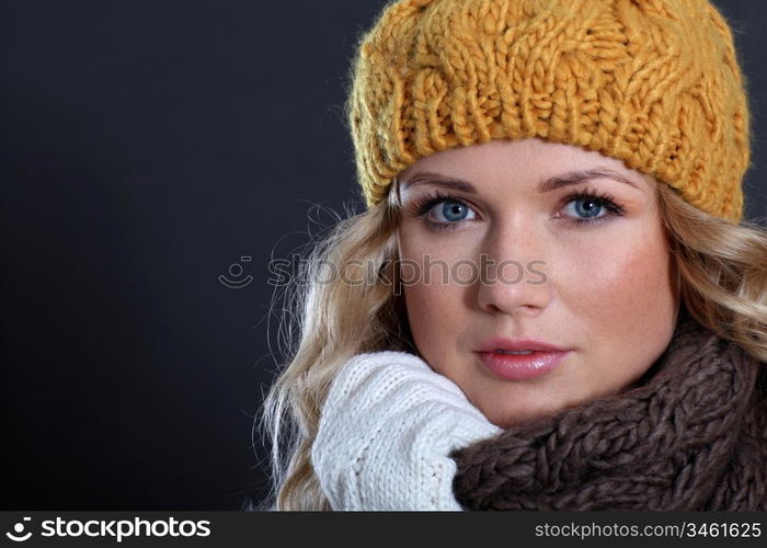 Portrait of beautiful woman wearing winter accessories